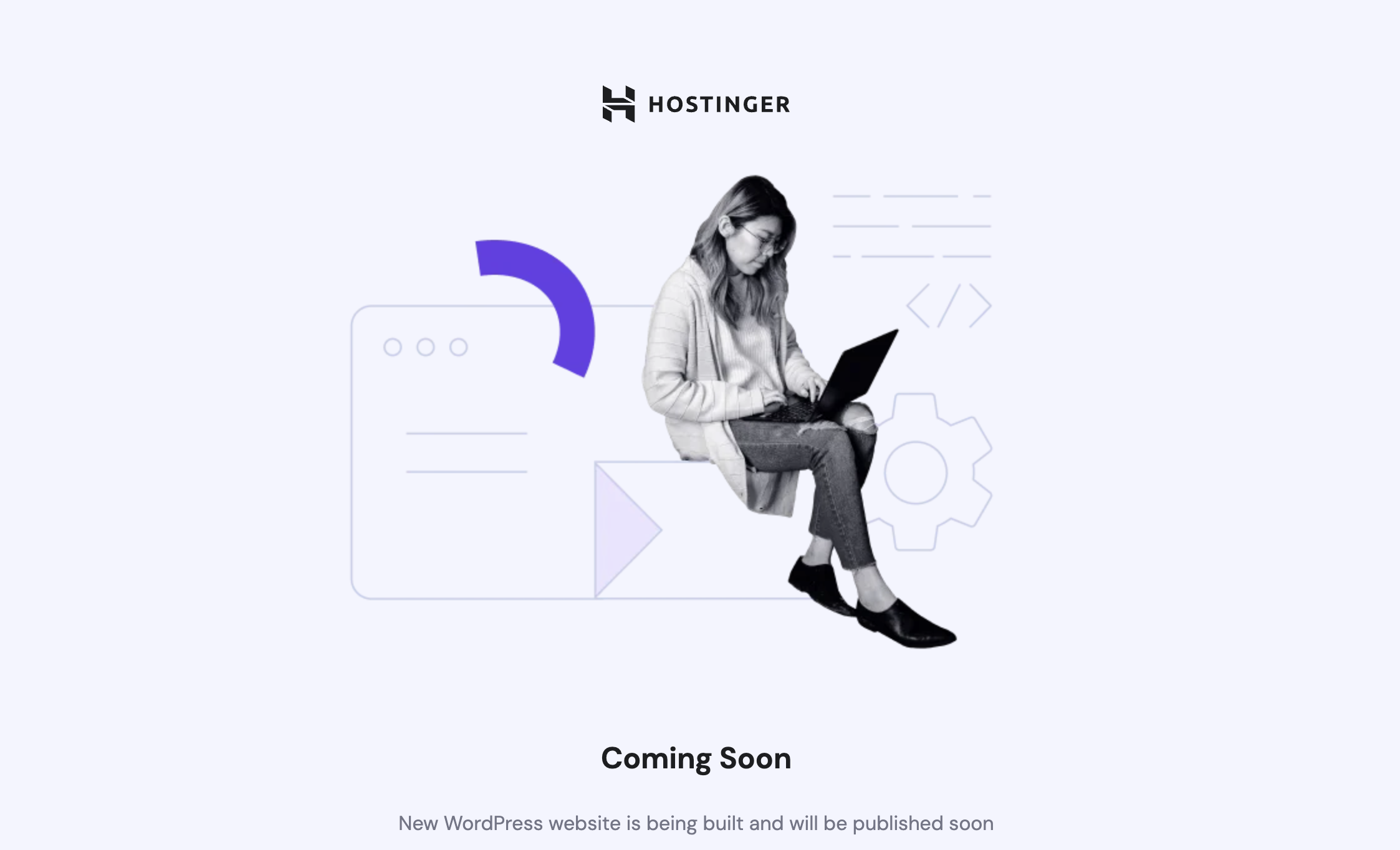 Hostinger maintenance page with “Coming Soon” message and person using laptop