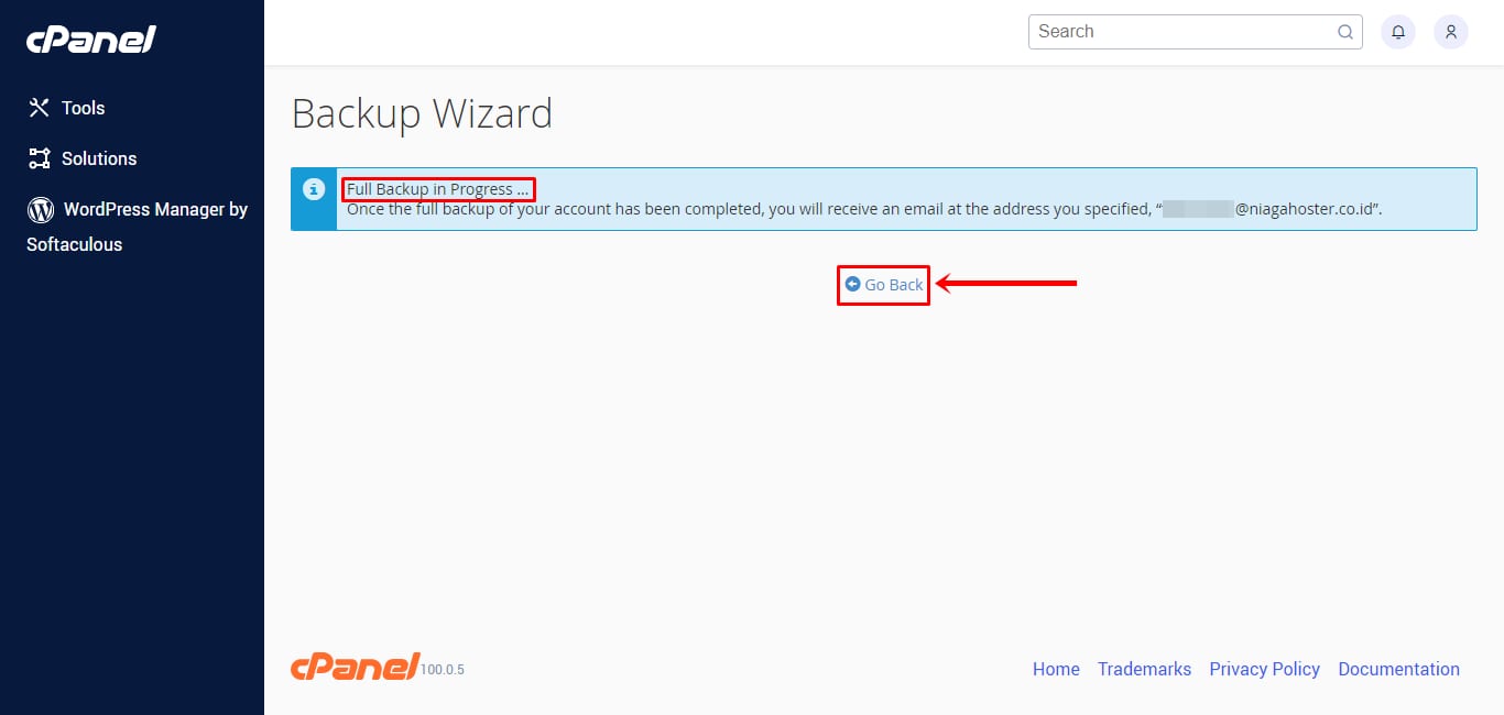 cPanel Backup Wizard showing Full Backup in Progress and highlighted Go Back button