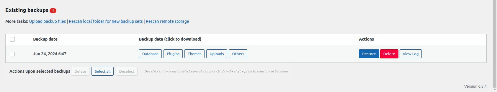 Existing WordPress backup list with Restore and Delete buttons highlighted for one backup set