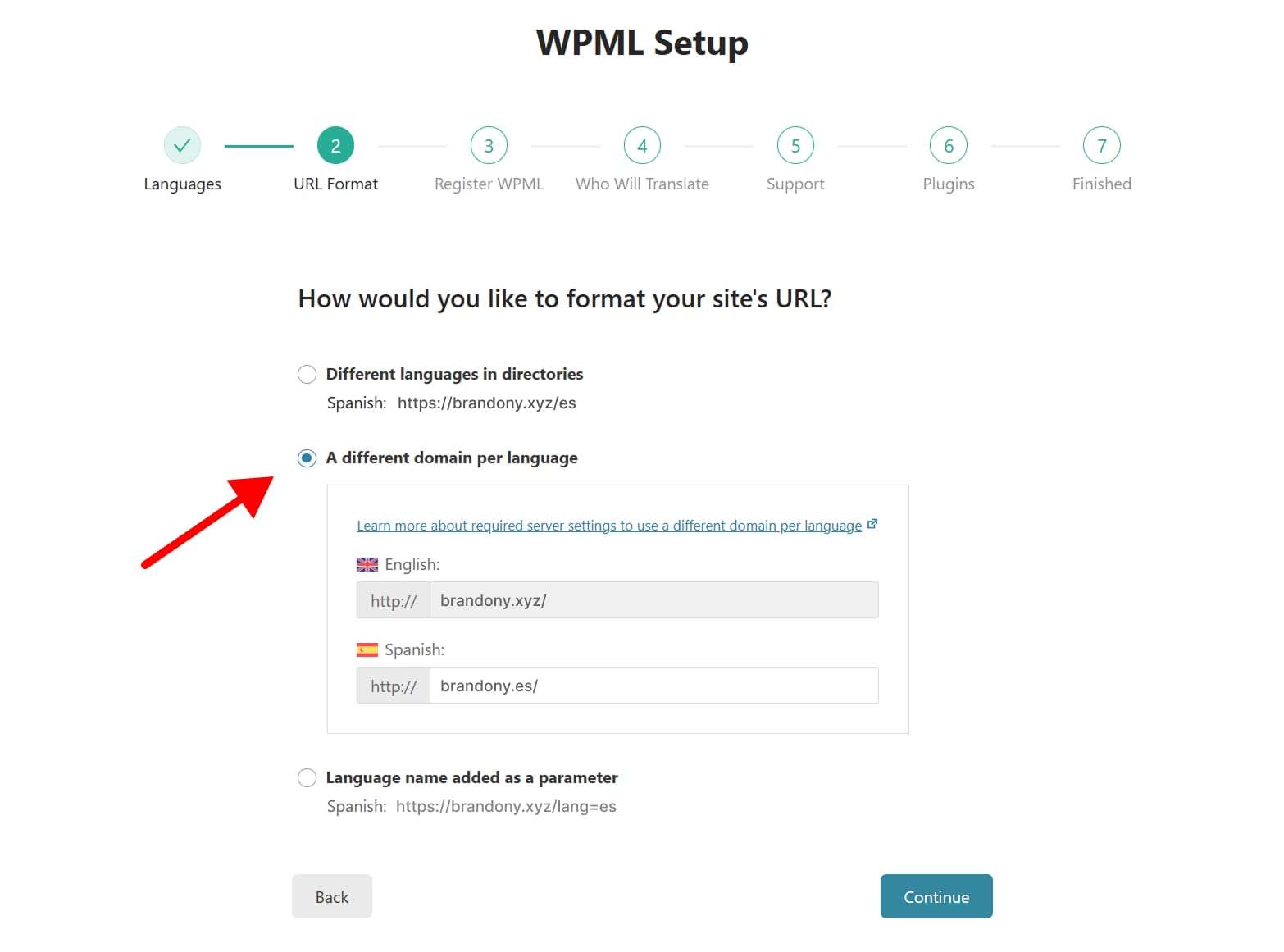 WPML Setup step 2 selecting different domain per language, with the radio option highlighted